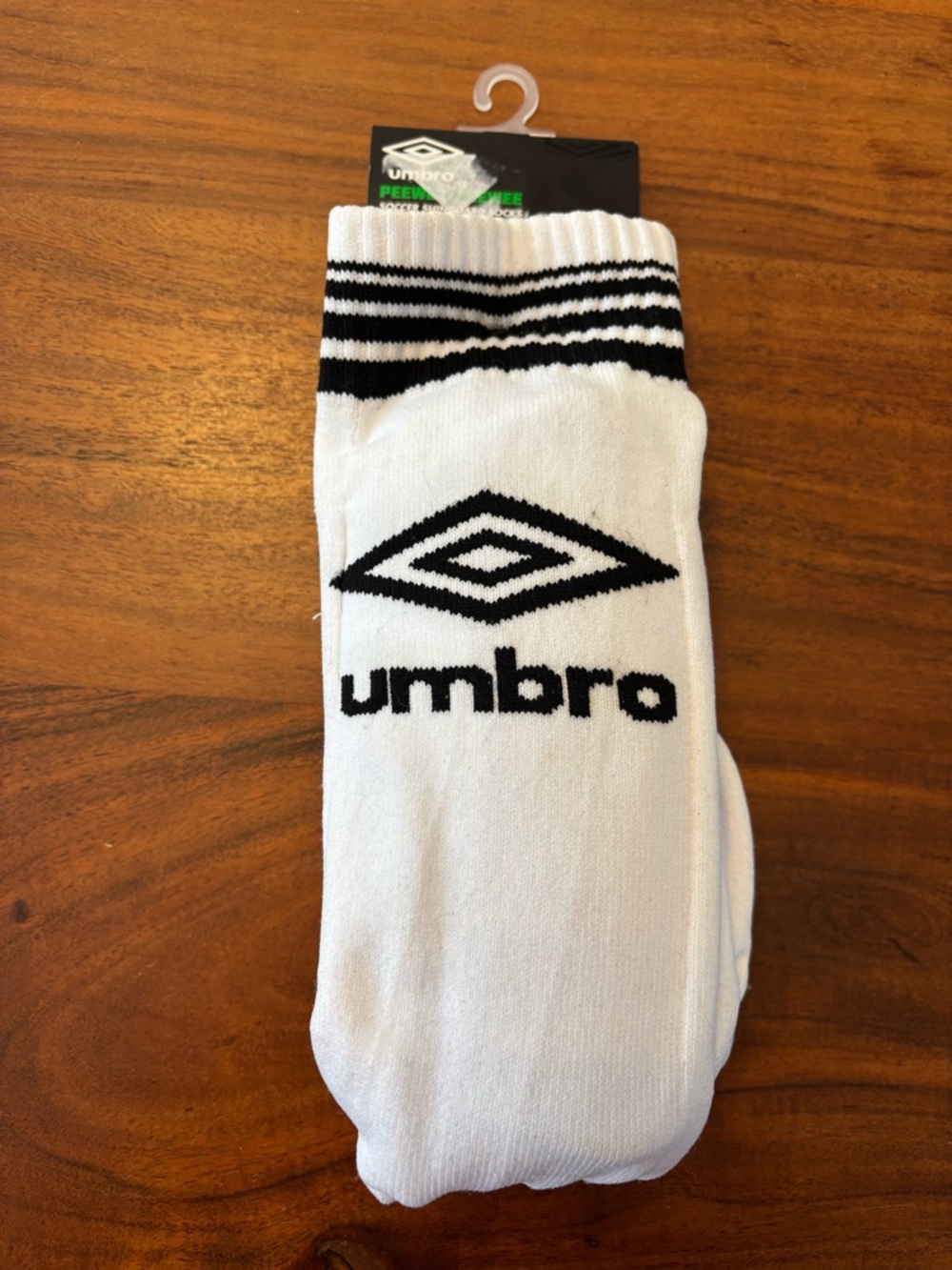 Umbro White Crew Socks with Black Logo & Stripes and built in shin guards peewee